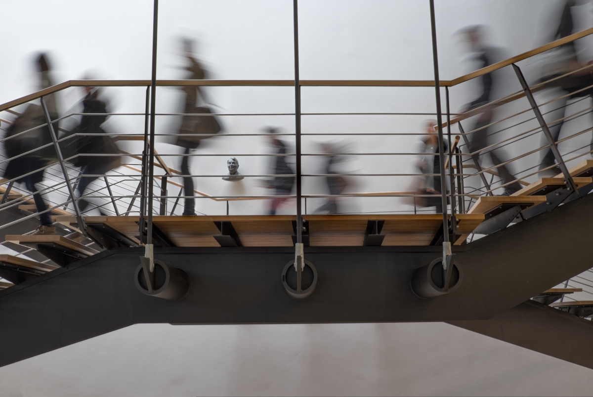 Image people walking down flight of stairs